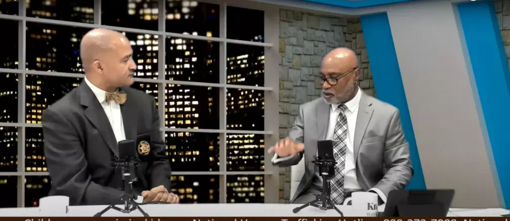 Two Men Having Conversation on TV